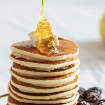 Jim's Diner - a stack of pancakes with syrup and berries - New American Near Me - Bethany, Oklahoma Jim's Diner - a stack of pancakes with syrup and berries - New American Near Me - Bethany, Oklahoma