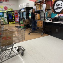 Family Fare Supermarket - Employee not wearing masks and walking up and down full checkout aisles talking to other employees