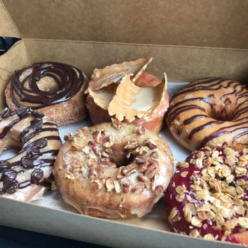 Vortex Doughnuts - Top L to R: -vortex (yeast) -blood orange waffle (y) -chocolate chai (y) -PB choc (cake) -banana pecan espresso (c) -Blackberry granola (y) - Coffee & Tea Near Me - Asheville, North Carolina Vortex Doughnuts - Top L to R: -vortex (yeast) -blood orange waffle (y) -chocolate chai (y) -PB choc (cake) -banana pecan espresso (c) -Blackberry granola (y) - Coffee & Tea Near Me - Asheville, North Carolina