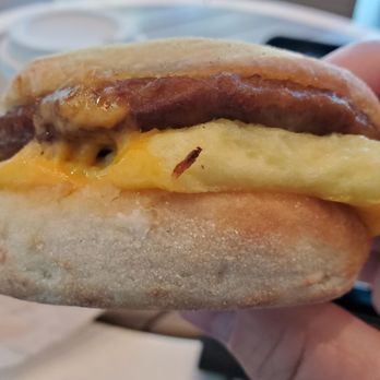 Starbucks - a hand holding a sausage and egg breakfast sandwich - Coffee & Tea Near Me - Sacramento, California Starbucks - a hand holding a sausage and egg breakfast sandwich - Coffee & Tea Near Me - Sacramento, California