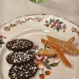 After dessert migardise: tiny chocolate shortbread, candied orange peels, with mint tea After dessert migardise: tiny chocolate shortbread, candied orange peels, with mint tea