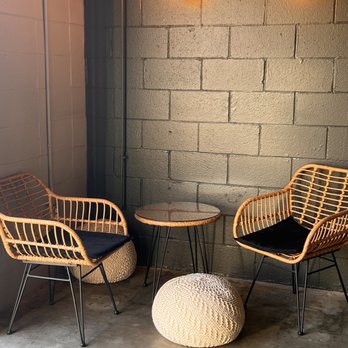 Social Project Brewing - two wicker chairs and a table - Breweries Near Me - Bentonville, Arkansas Social Project Brewing - two wicker chairs and a table - Breweries Near Me - Bentonville, Arkansas