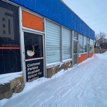 Noodleholic - the entrance to a restaurant in the snow - Noodles Near Me - Edmonton, Alberta