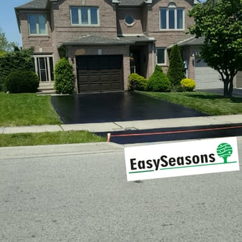 EasySeasons - a sign in front of a house - General Contractors Near Me EasySeasons - a sign in front of a house - General Contractors Near Me