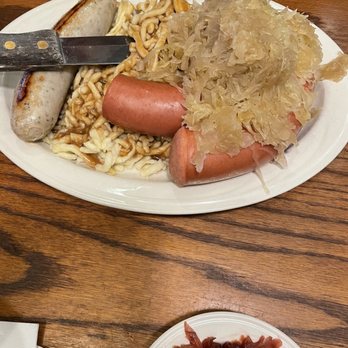 Metzger's German Restaurant - 3 different types of sausages with spaeztle and sauerkraut - German Near Me - Ann Arbor, Michigan
