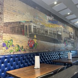 Upstairs seating area with mural