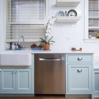 Rosalie Remodeling - a kitchen with blue cabinets and white countertops - General Contractors Near Me - Evanston, Illinois Rosalie Remodeling - a kitchen with blue cabinets and white countertops - General Contractors Near Me - Evanston, Illinois