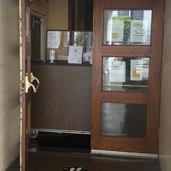 Hertz Rent a Car - This is the office... a doorway in a homeless hotel shelter.