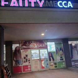 Beauty Mecca - Sign at night. Needs a little repair but visible.