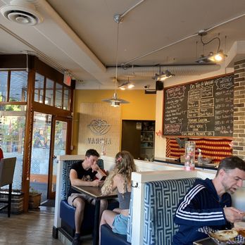 Varsha Indian Kitchen - a group of people eating - Gluten-Free Near Me - Victoria, British Columbia Varsha Indian Kitchen - a group of people eating - Gluten-Free Near Me - Victoria, British Columbia