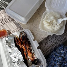 a tray of food and a container of rice