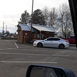 a white car parked in a parking lot
