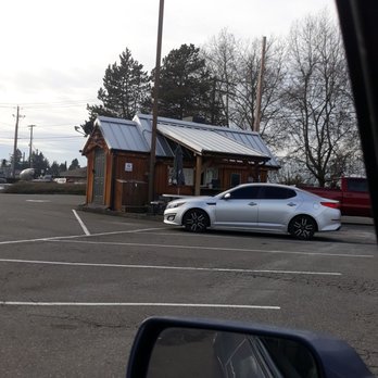 Homestead Brew - a white car parked in a parking lot - Coffee & Tea Near Me - Sumner, Washington