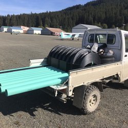 Ferguson Plumbing Supply - A stack of septic vaults from Ferguson. Stuffed in a plane , then onto a mini truck.