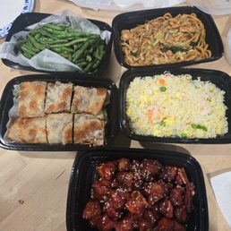 Green beans, chicken chow mien, beef rolls, shrimp fried rice, and sweet n' sour riblets.