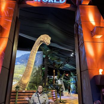 Jurassic World the Exhibition - Brachiosaurus at the iconic gates - Amusement Parks Near Me - Katy, Texas