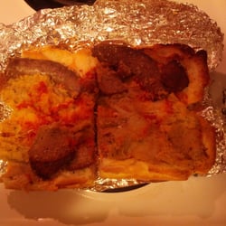 Village Pizza Restaurant - Certainly not appetizing! Notice the burnt sausage on the right side top and the slice of meatball.