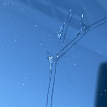 Safelite AutoGlass - The single hole, dead-center, is what was on the car prior to Emmanuel's "repair."  The big cracks came after Safelite showed up. - Windshield Installation & Repair Near Me - Las Vegas, Nevada