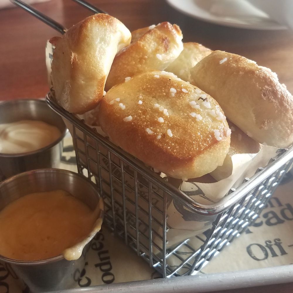 Dogfish Head Brewings & Eats - Pretzel Bites with cheddar and Honey Mustard dipping sauces - American Near Me - Rehoboth Beach, Delaware Dogfish Head Brewings & Eats - Pretzel Bites with cheddar and Honey Mustard dipping sauces - American Near Me - Rehoboth Beach, Delaware