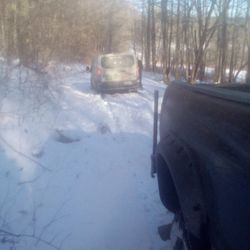 West Main Auto Repair and Towing - Delivery drivers GPS sent him down unmaintained seasonal road, had to plow the the road and tow him out.
