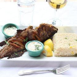 Old City Cafe & Grill - Grilled lamb chops served with seasoned rice, vegetables, and house-made sauce.