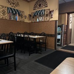 Aldo's Pizzeria & The Red Brick Pub - A look towards the back of the restaurant - restroom doors and an entrance to the bar on the right.