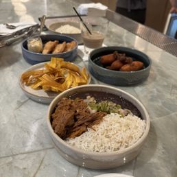Empanadas, croquettas, plantain chips, ropa vieja with rice and tomatillo sauce.