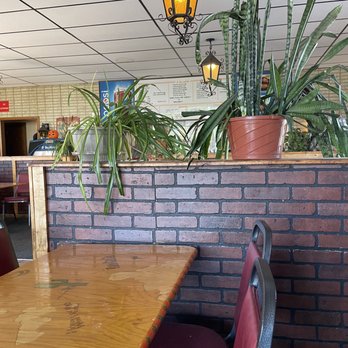 Taco Casita - a table and chairs in a restaurant - Mexican Near Me - Terre Haute, Indiana