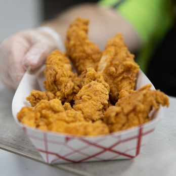 Hartnell Ave Chevron Power Market - a person holding a basket of fried chicken - Gas Stations Near Me - Redding, California Hartnell Ave Chevron Power Market - a person holding a basket of fried chicken - Gas Stations Near Me - Redding, California
