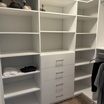 Closets by Design - Jacksonville - large closet with 3 walls walls of shelves and drawers with plenty handing too! - Home Organization Near Me - Jacksonville, Florida Closets by Design - Jacksonville - large closet with 3 walls walls of shelves and drawers with plenty handing too! - Home Organization Near Me - Jacksonville, Florida