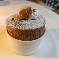 The Fearrington House Restaurant - Dessert. Valrhona Coeur de Guanaja Souffle. Dark chocolate, vanilla, whipped cream. Finished tableside.