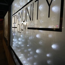 Community Clay - Front window showing Community Clay sign