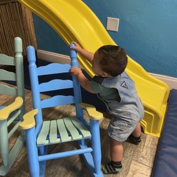 They have chairs for kids, a play mat, and a slide. My baby boy loved everything about this place. They have chairs for kids, a play mat, and a slide. My baby boy loved everything about this place.