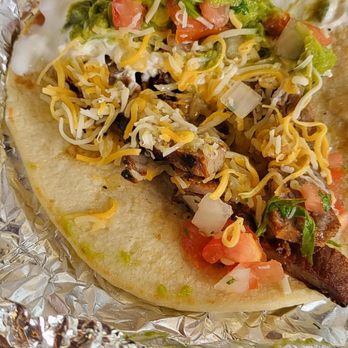 Taco Cabana - Half cold taco with a glob of sour cream on one side - Mexican Near Me - Austin, Texas Taco Cabana - Half cold taco with a glob of sour cream on one side - Mexican Near Me - Austin, Texas