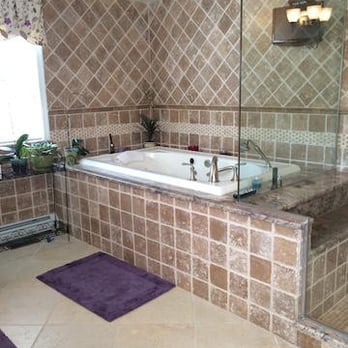 Safe Vent - a bathroom with a tub and shower - General Contractors Near Me Safe Vent - a bathroom with a tub and shower - General Contractors Near Me