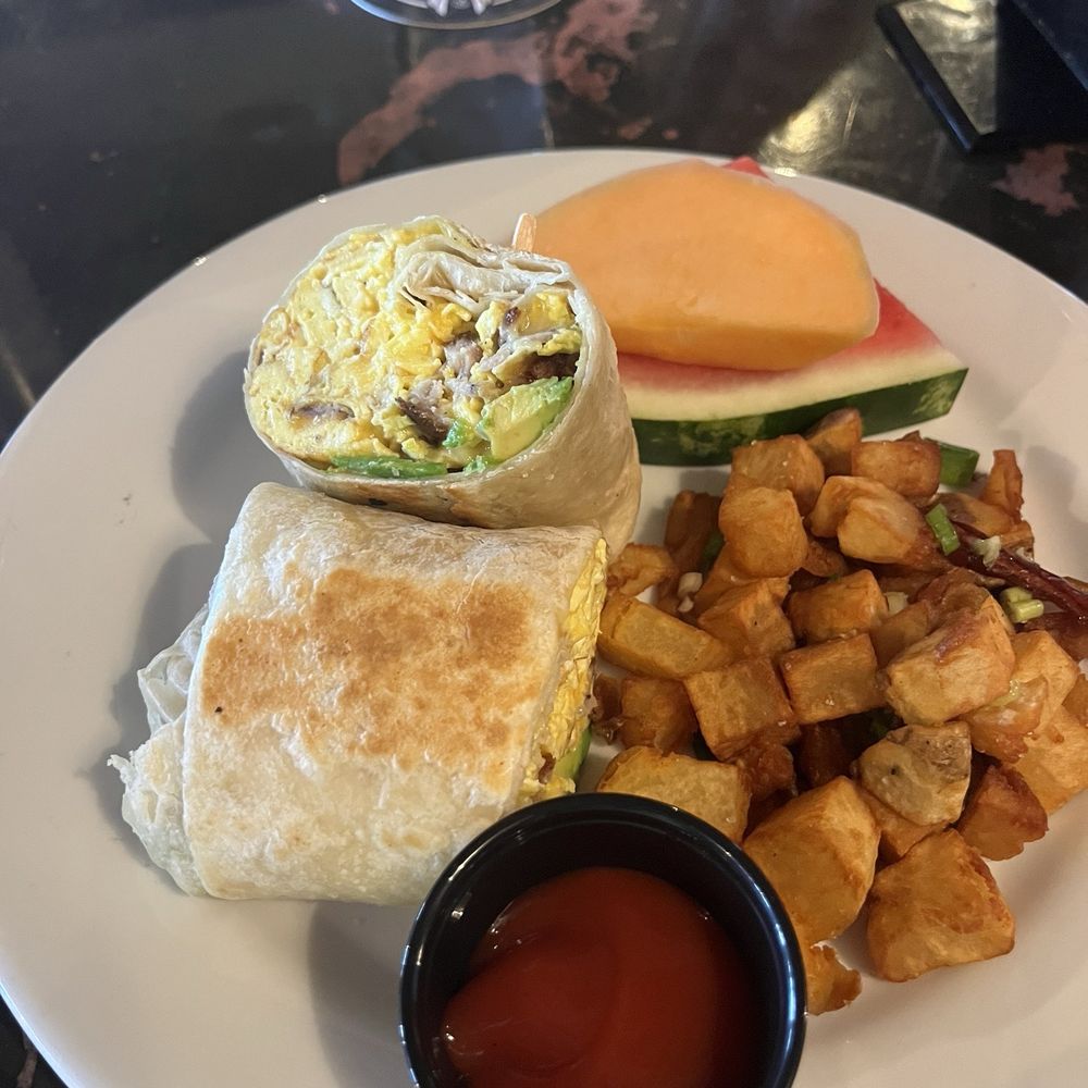 K C Branaghan's - Breakfast burrito with egg, cheese, avocado, and bangers with a side of fruit and potatoes. - Irish Near Me - Long Beach, California K C Branaghan's - Breakfast burrito with egg, cheese, avocado, and bangers with a side of fruit and potatoes. - Irish Near Me - Long Beach, California