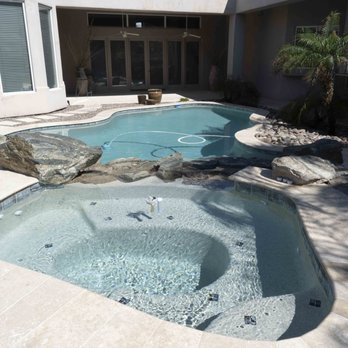 Barefoot Pools - After - spa with travertine decking - Pool Cleaners Near Me - Gilbert, Arizona Barefoot Pools - After - spa with travertine decking - Pool Cleaners Near Me - Gilbert, Arizona