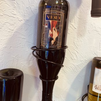 The Corner Store, Downtown Naples - a wine bottle on a wine rack - Wine Tasting Room Near Me - Naples, Florida The Corner Store, Downtown Naples - a wine bottle on a wine rack - Wine Tasting Room Near Me - Naples, Florida