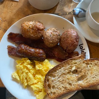 Lola - bacon,Smashed Garlic Fried Potatoes, toast  House made pork - maple sausage Two eggs any style - Greek Near Me - Seattle, Washington