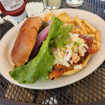 Jason's Beachside Grille - The Nashville Chicken sandwich. Spicy and tasty, with slaw & fixings on a bun. - New American Near Me - Kings Beach, California Jason's Beachside Grille - The Nashville Chicken sandwich. Spicy and tasty, with slaw & fixings on a bun. - New American Near Me - Kings Beach, California