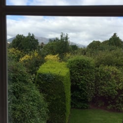 Killarney Lodge Guesthouse - One view from window on second floor, rear corner.
