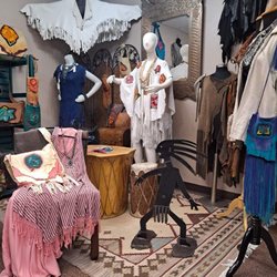 Wild Moon Boutique - La Paloma, white deerskin, has over 10 dozen hand cut feathers. Handmade button is rose quartz. Peace & Love