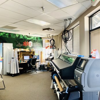 Alpha Graphics - Arvada - Design area and conference room at the Arvada center. - Printing Services Near Me - Arvada, Colorado