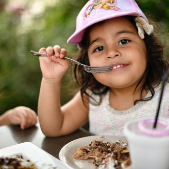 La Cocina de Roberto - My daughters eating their favorite nachos! - Latin American Near Me - Spring, Texas La Cocina de Roberto - My daughters eating their favorite nachos! - Latin American Near Me - Spring, Texas