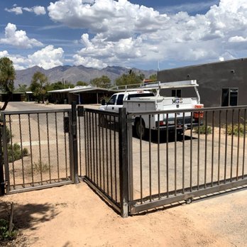 Moving Gate Systems - Residential iron fence with driveway auto gate - Fences & Gates Near Me - Tucson, Arizona Moving Gate Systems - Residential iron fence with driveway auto gate - Fences & Gates Near Me - Tucson, Arizona