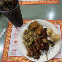 a plate of food and a drink a plate of food and a drink