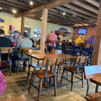 Mango Marley's - people sitting at tables in a restaurant - American Near Me - Mexico Beach, Florida Mango Marley's - people sitting at tables in a restaurant - American Near Me - Mexico Beach, Florida
