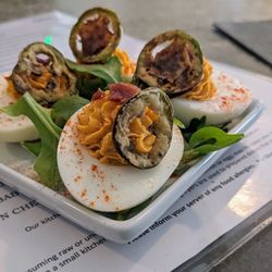 Bite American Tapas - Prosciutto deviled eggs topped with fried jalapeño