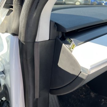 Tesla Motors - Pinched door seal, missing end cap - Auto Repair Near Me - Milford, Connecticut Tesla Motors - Pinched door seal, missing end cap - Auto Repair Near Me - Milford, Connecticut