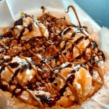 Funnel Cakes & More - Snickers funnel cake with chocolate and caramel drizzle. - Desserts Near Me - Arlington, Texas Funnel Cakes & More - Snickers funnel cake with chocolate and caramel drizzle. - Desserts Near Me - Arlington, Texas